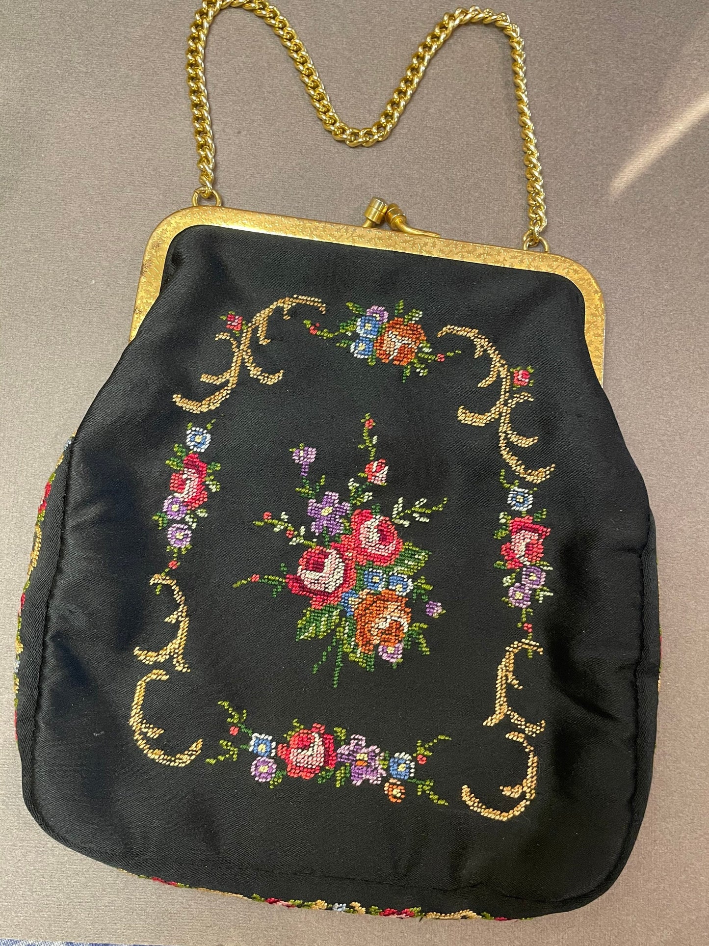 Small vintage embroidered fabric bag on a chain